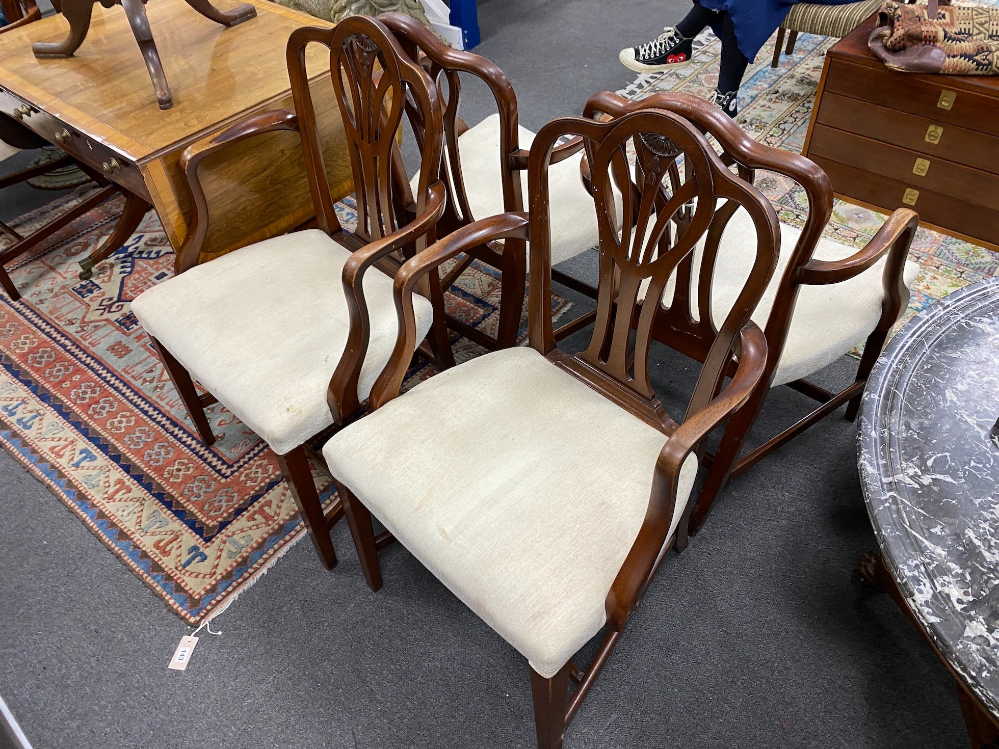 A set of ten George III style mahogany dining chairs